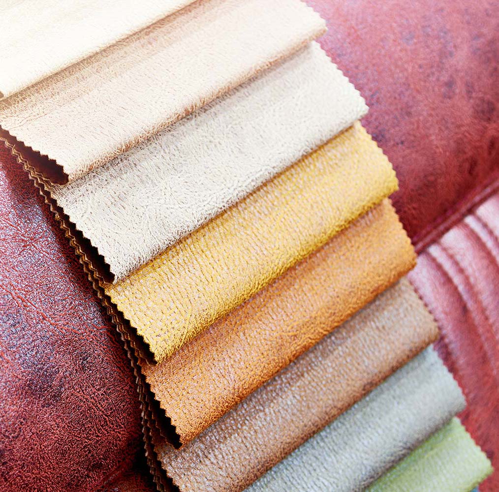 Upholstery fabric swatches draped on a couch