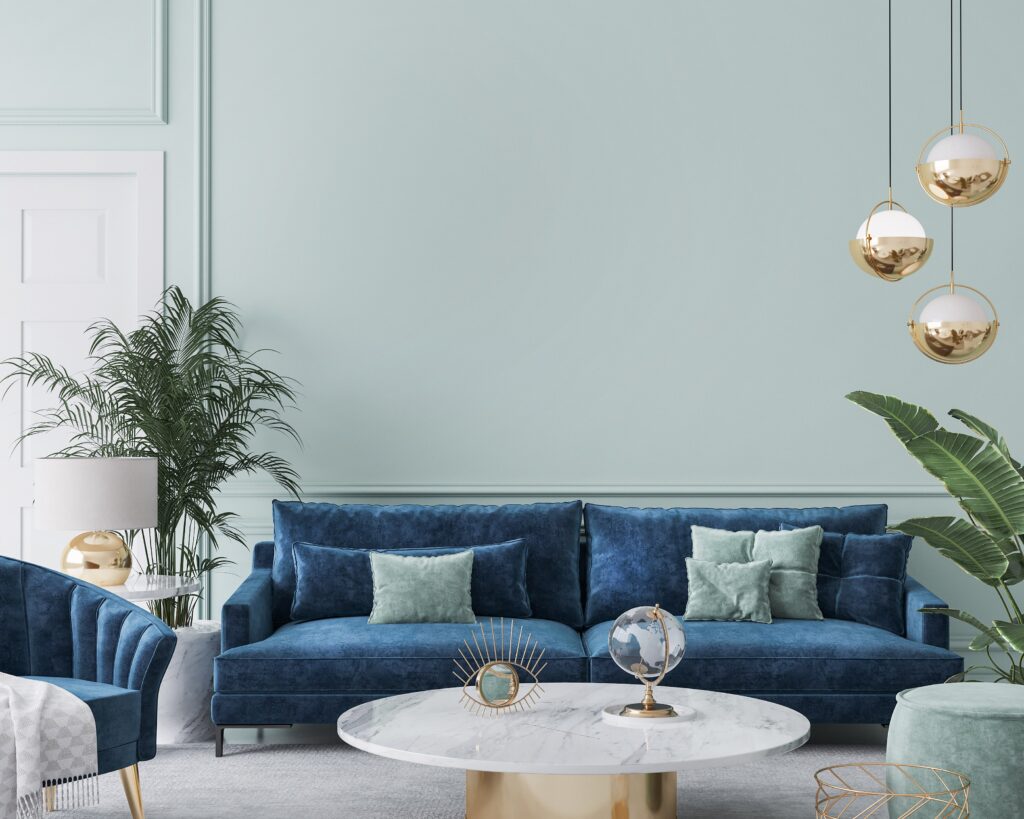 Image of a living room with a blue couch and decor